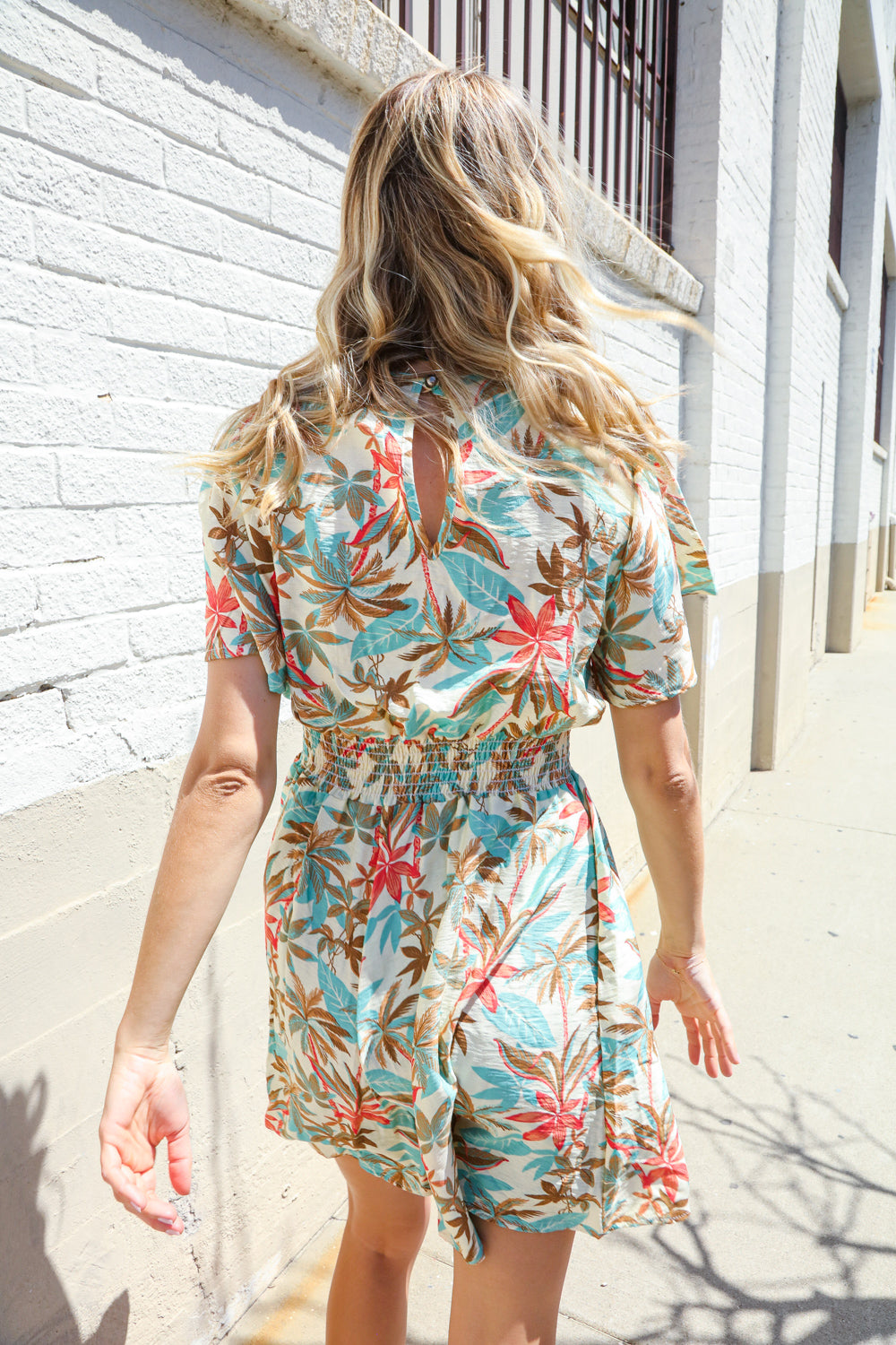 Get Whimsical Tropical Print Smocked Waist Neck Button Romper